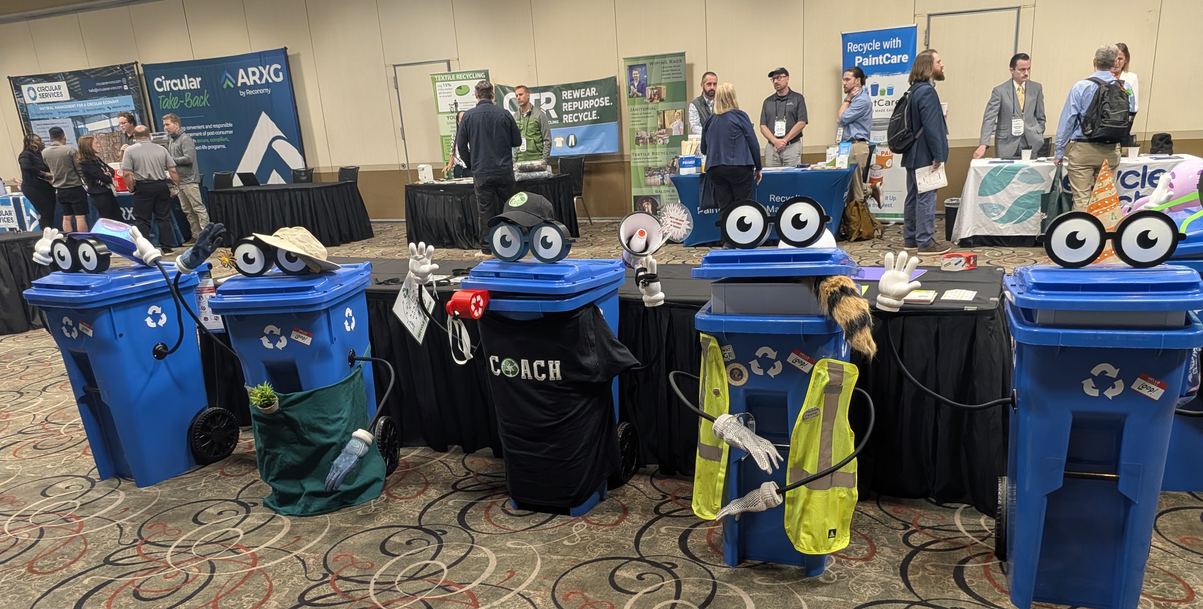 Five decorated Loop recycling carts at ICC 2026